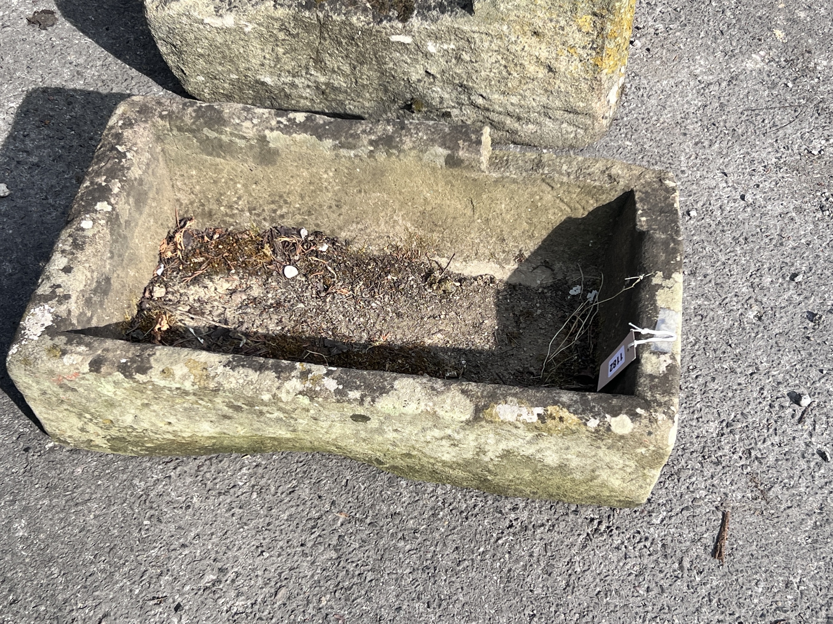 A sandstone trough, length 66cm, depth 39cm, height 19cm